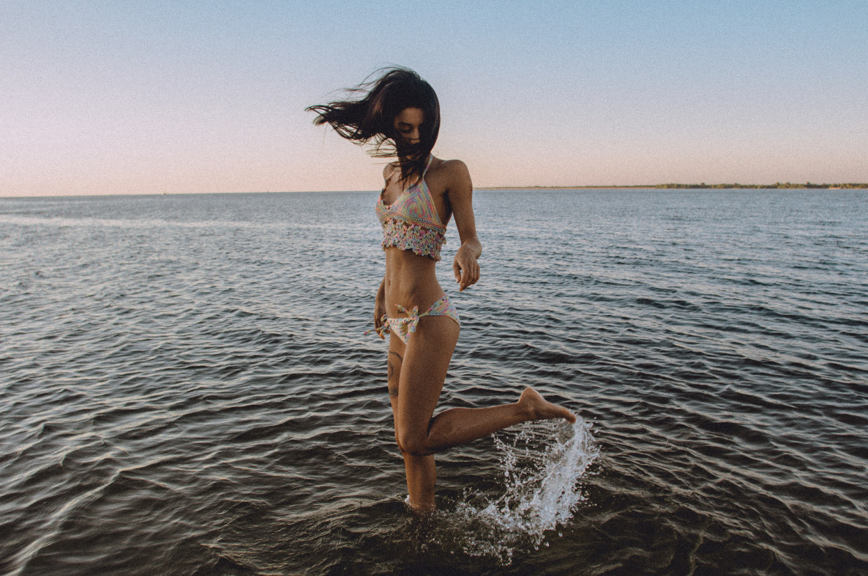 Woman in white bikini in water